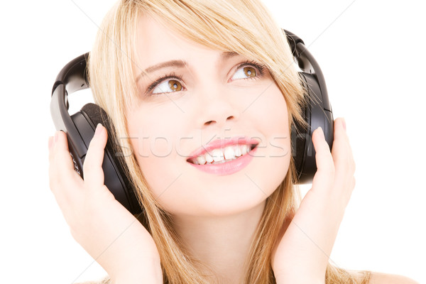 Música feliz auriculares blanco mujer Foto stock © dolgachov