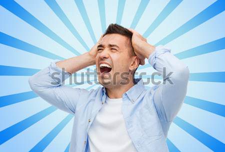 Stock photo: smiling woman with fingers in ears