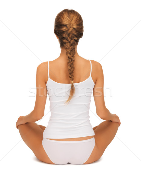 Vrouw oefenen yoga lotus pose Stockfoto © dolgachov