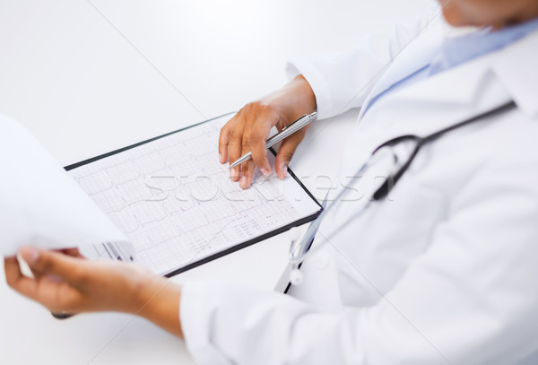 Р°Сѓmale doctor studies cardiogram Stock photo © dolgachov