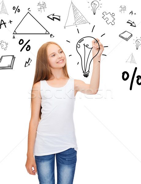 girl in white shirt drawing idea on virtual screen Stock photo © dolgachov