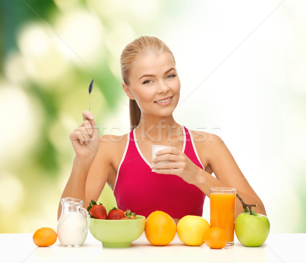 young woman eating healthy breakfast Stock photo © dolgachov