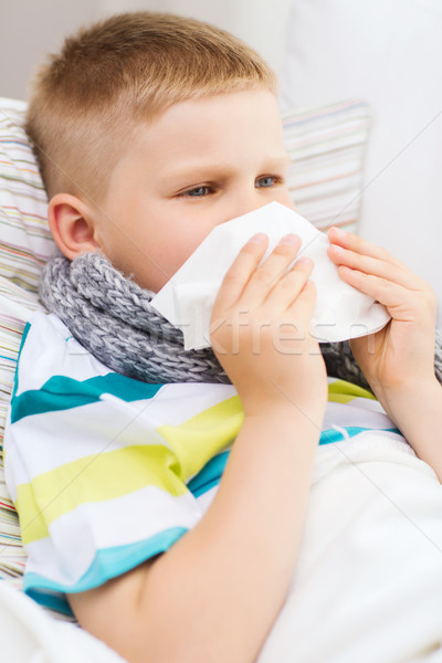 ill boy with flu at home Stock photo © dolgachov