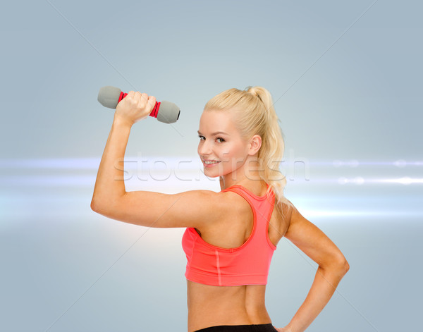 young sporty woman with light dumbbell Stock photo © dolgachov