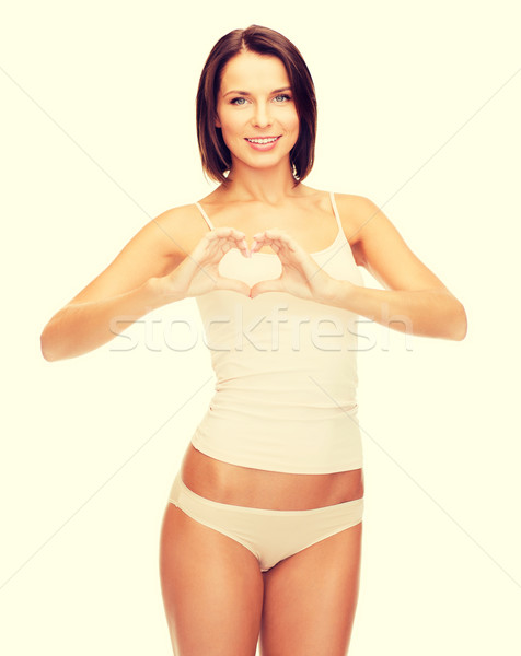 woman forming heart shape Stock photo © dolgachov