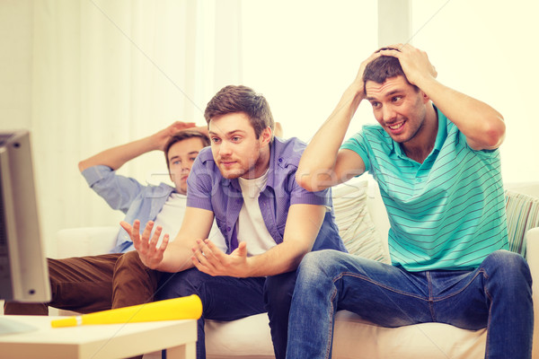 Triste Homme amis regarder sport amitié [[stock_photo]] © dolgachov