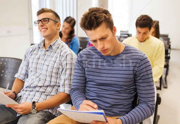 group of smiling students in lecture hall Stock photo © dolgachov