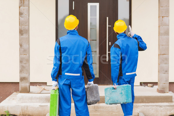 Grupy budowniczych działalności budynku zespołowej ludzi Zdjęcia stock © dolgachov
