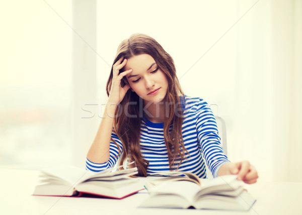 stressed student girl with books Stock photo © dolgachov