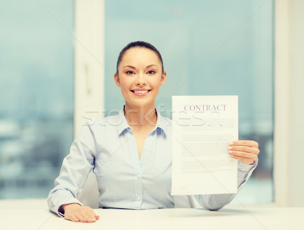 happy businesswoman holding contract in office Stock photo © dolgachov