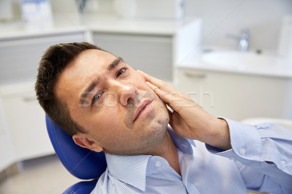 Zdjęcia stock: Człowiek · ból · zęba · posiedzenia · stomatologicznych · krzesło · ludzi