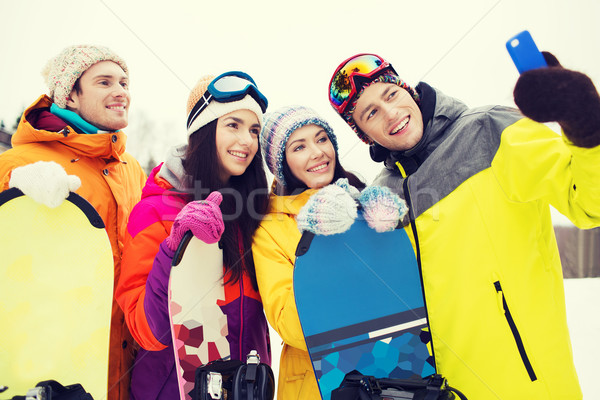 Heureux amis smartphone sports d'hiver loisirs amitié [[stock_photo]] © dolgachov