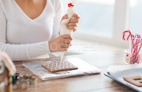 close up of woman making gingerbread houses Stock photo © dolgachov