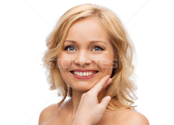 Mosolygó nő meztelen vállak megérint arc szépség Stock fotó © dolgachov