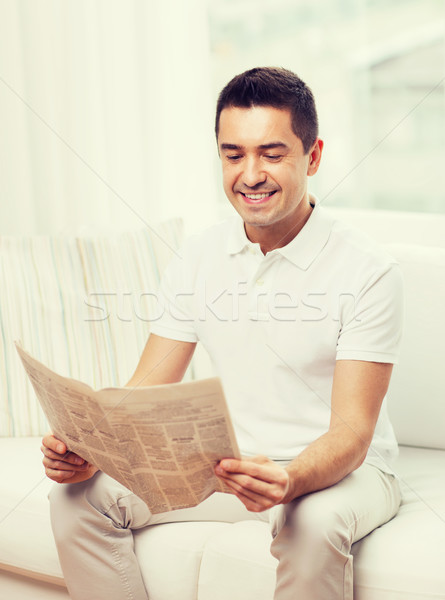 happy man reading newspaper at home Stock photo © dolgachov