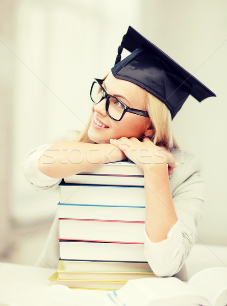 student in graduation cap Stock photo © dolgachov