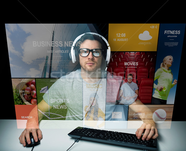 man in headset computer over virtual media screen Stock photo © dolgachov
