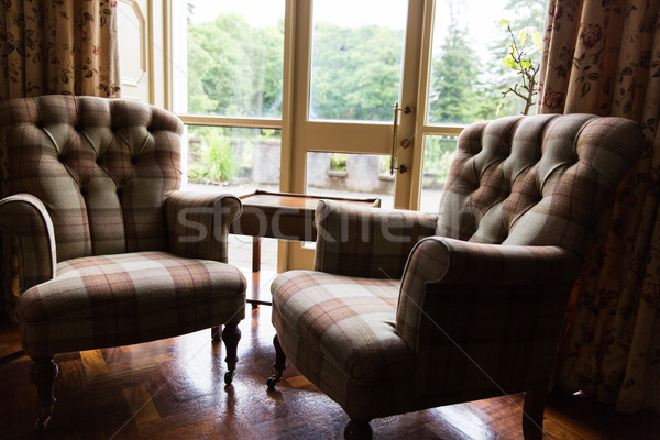 close up of vintage armchairs and table in hotel Stock photo © dolgachov