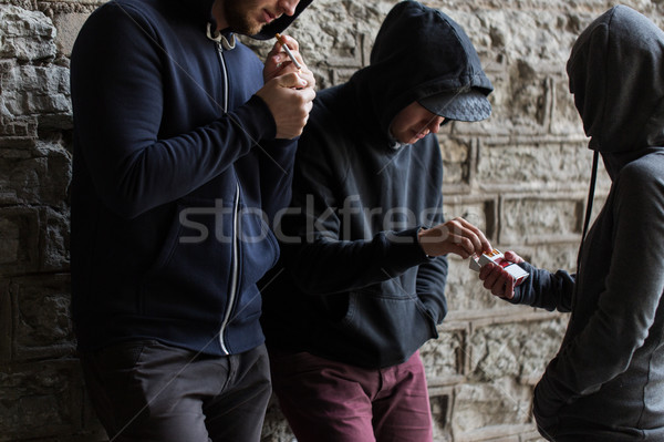 close up of young people smoking cigarettes Stock photo © dolgachov