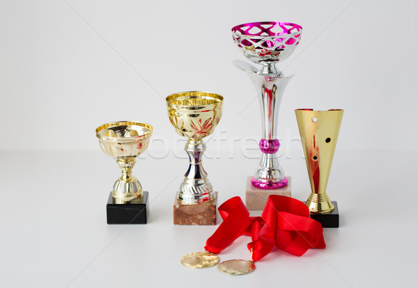 close up of sports golden cups and medals Stock photo © dolgachov