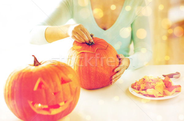 close up of woman with pumpkins at home Stock photo © dolgachov