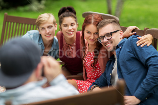 happy friends having dinner at summer garden party Stock photo © dolgachov