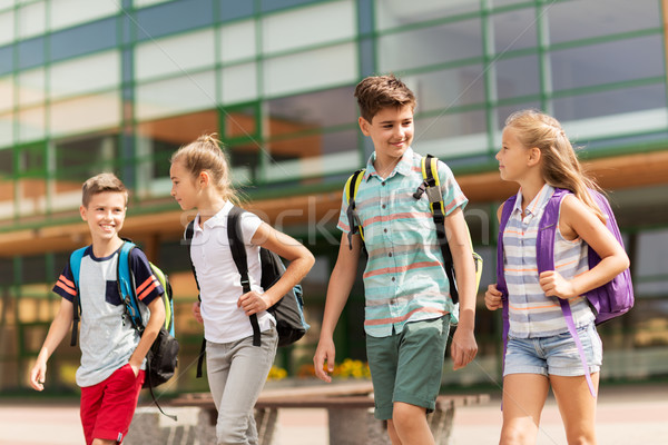 Groupe heureux école élémentaire élèves marche primaire [[stock_photo]] © dolgachov