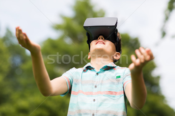 boy with virtual reality headset outdoors Stock photo © dolgachov
