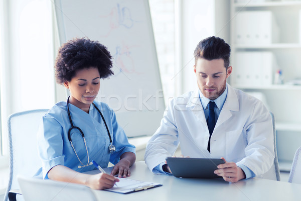 two doctors meeting at hospital office Stock photo © dolgachov