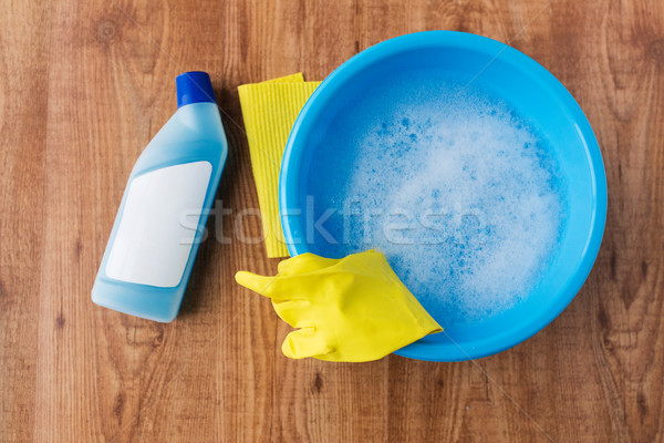 basin with cleaning stuff on wooden background Stock photo © dolgachov