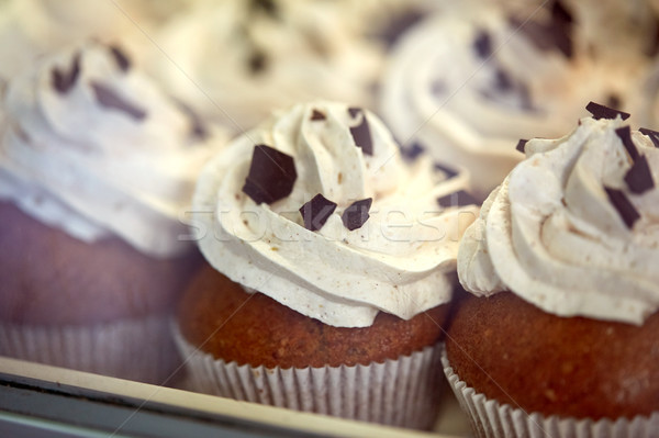 close up of cupcakes or muffins with frosting Stock photo © dolgachov