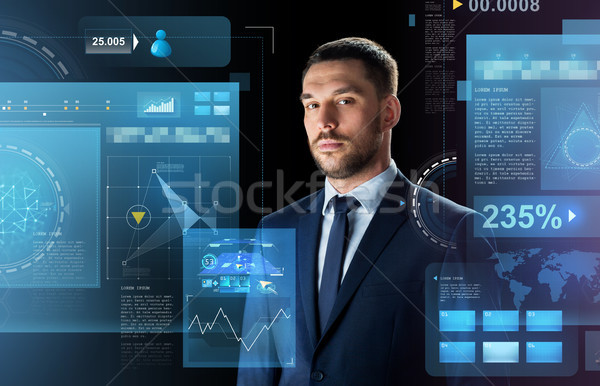 businessman in suit over black Stock photo © dolgachov