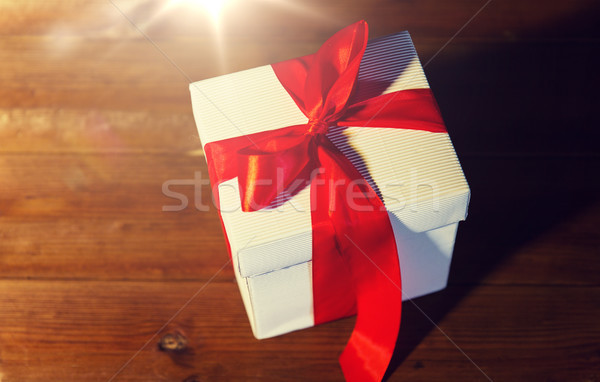 close up of christmas  gift box on wooden floor Stock photo © dolgachov