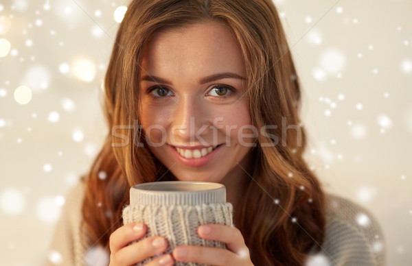 close up of woman with tea or coffee cup at home Stock photo © dolgachov