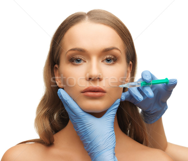 女人的臉 手 圖片 注射器 女孩 醫生 商業照片 © dolgachov