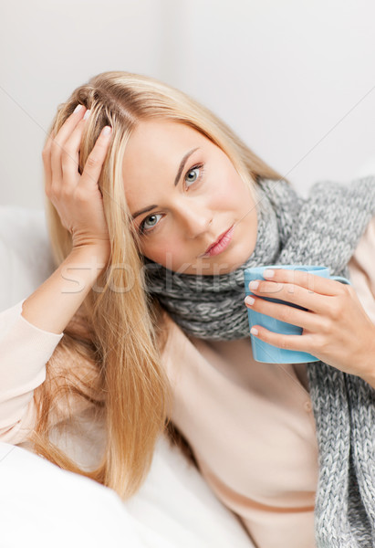 diseased woman with cup of tea Stock photo © dolgachov