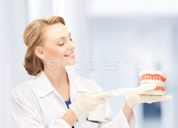 doctor with toothbrush and jaws in hospital Stock photo © dolgachov