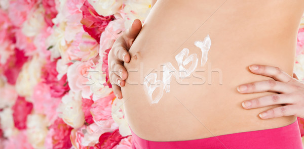 belly of a pregnant woman Stock photo © dolgachov