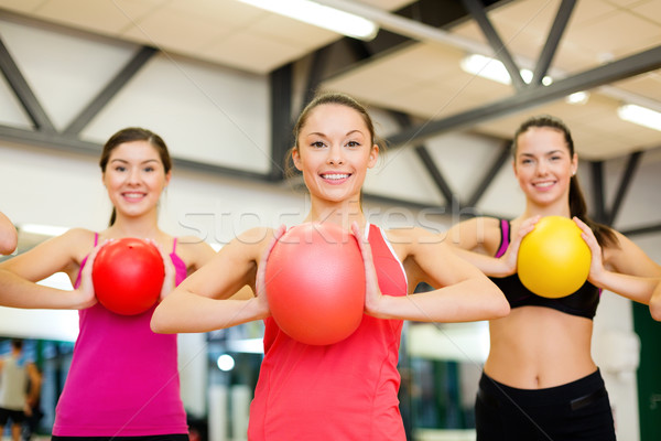 group of people working out with stability balls Stock photo © dolgachov