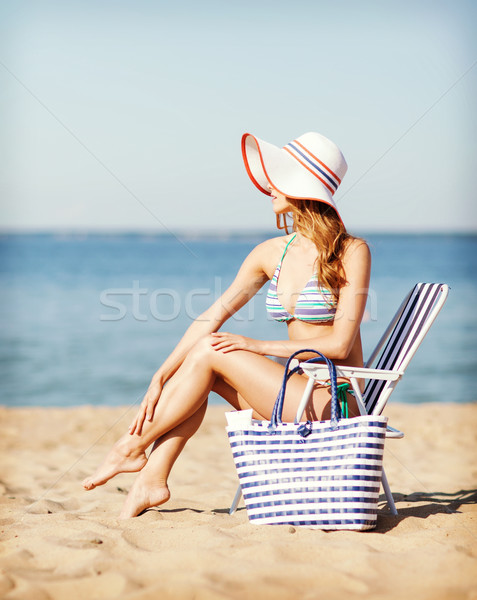 girl sunbathing on the beach chair Stock photo © dolgachov