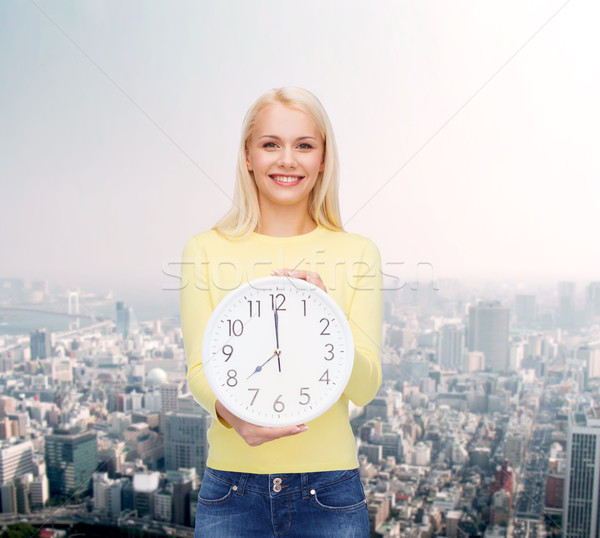 student with wall clock Stock photo © dolgachov