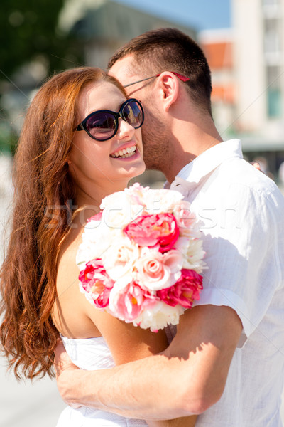 smiling couple in city Stock photo © dolgachov