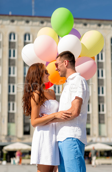 smiling couple in city Stock photo © dolgachov