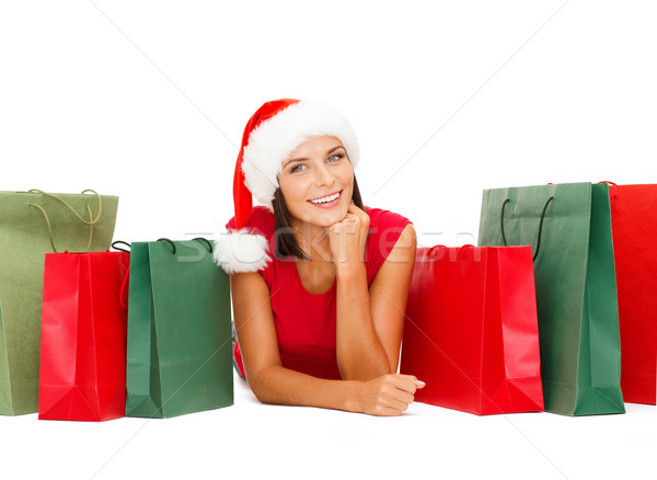 woman in red shirt with shopping bags Stock photo © dolgachov