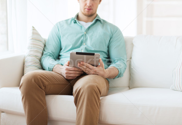 close up of man with tablet pc computer at home Stock photo © dolgachov