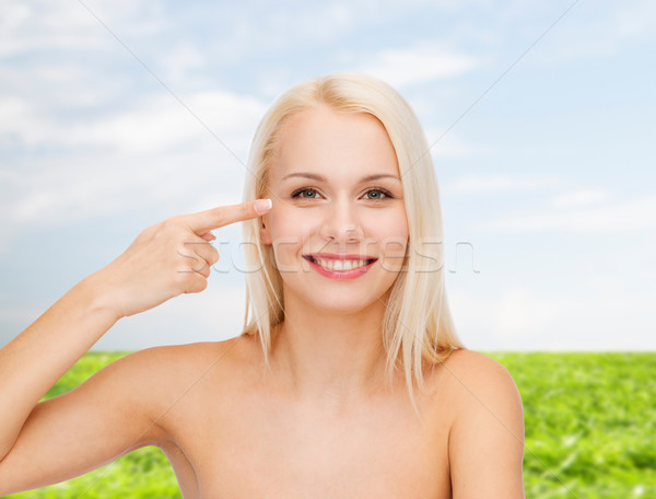 beautiful woman touching her eye area Stock photo © dolgachov
