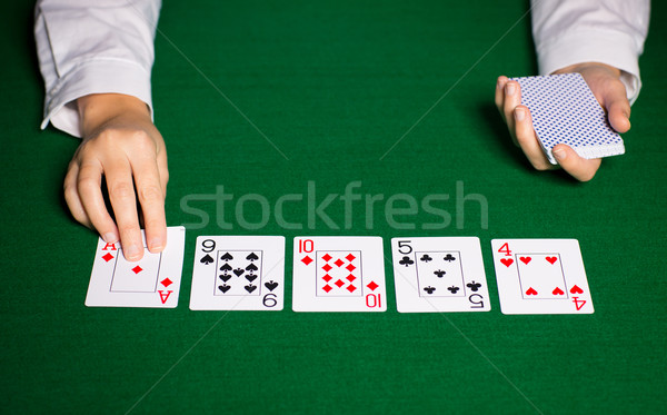 holdem dealer with playing cards Stock photo © dolgachov