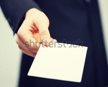 man in suit holding credit card Stock photo © dolgachov