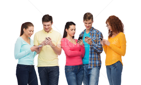 Stock photo: group of smiling teenagers with smartphones