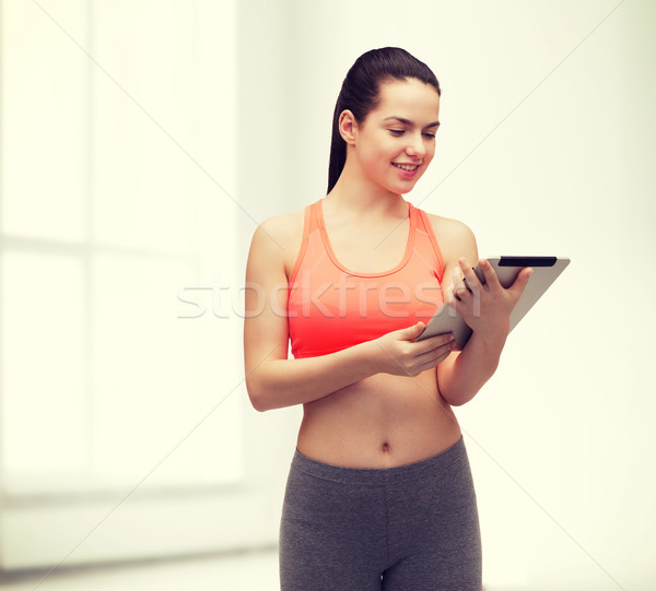 sporty woman with tablet pc computer Stock photo © dolgachov